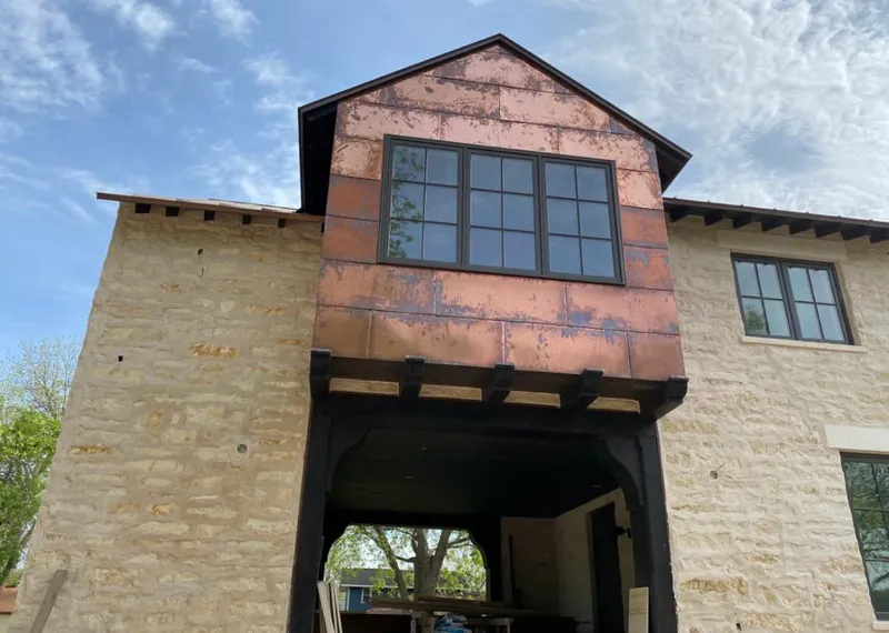 Copper metal panel facade on a stone building for Skylight Installation in Smiths Station