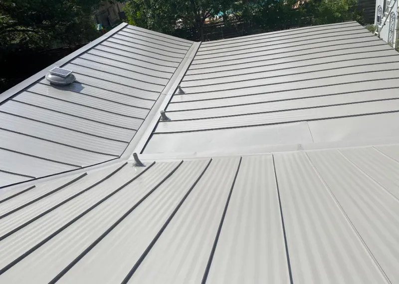 Solar attic fan installed on a metal roof for Roof Ventilation in Smiths Station